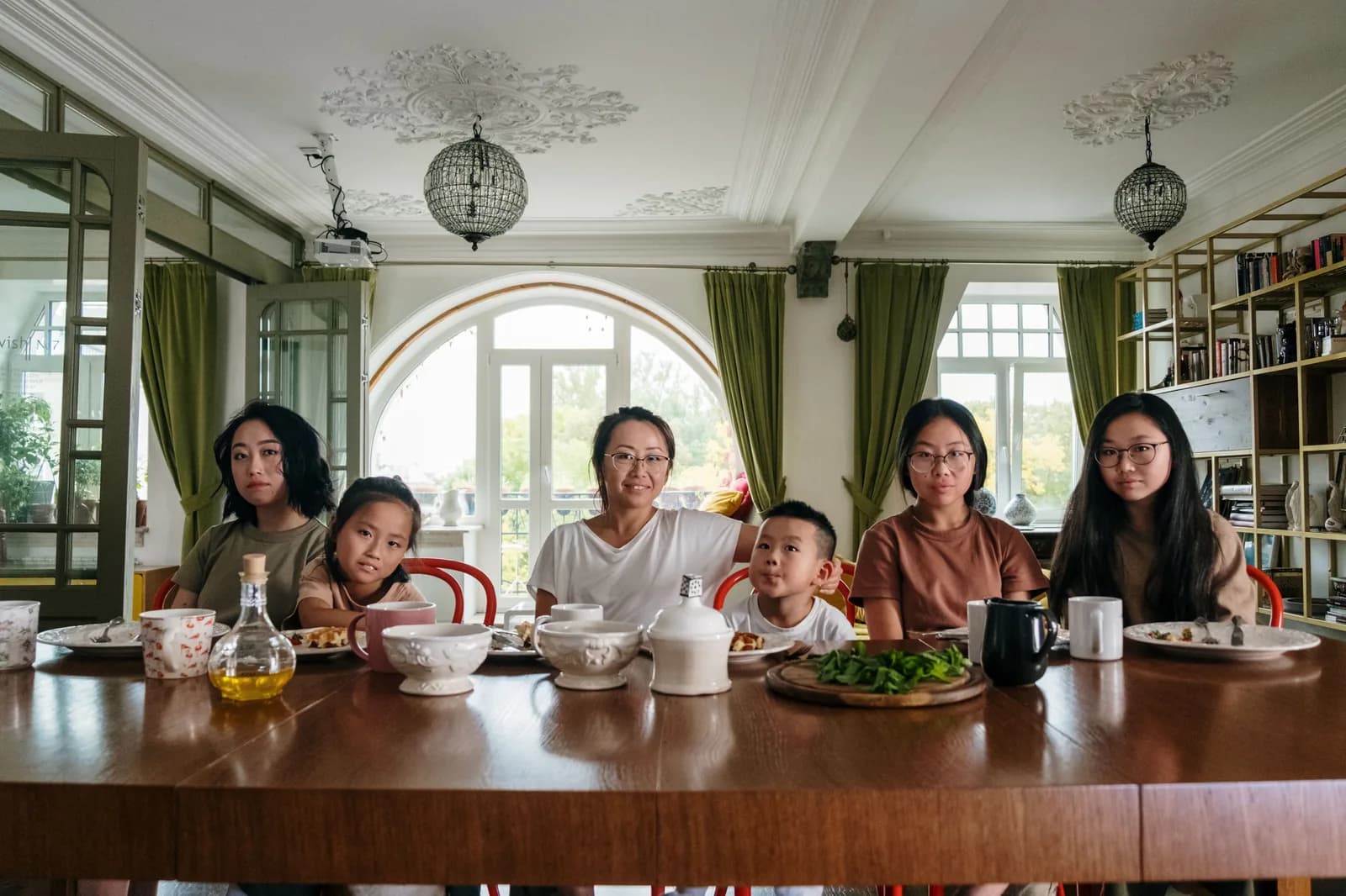 A family gathered around a dinner table at home