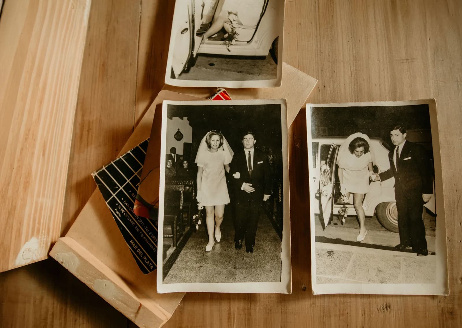 Vintage wedding photographs on a wooden table